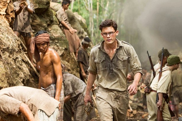The young Eric Lomax (Jeremy Irvine) when he first arrives at the railway camp.