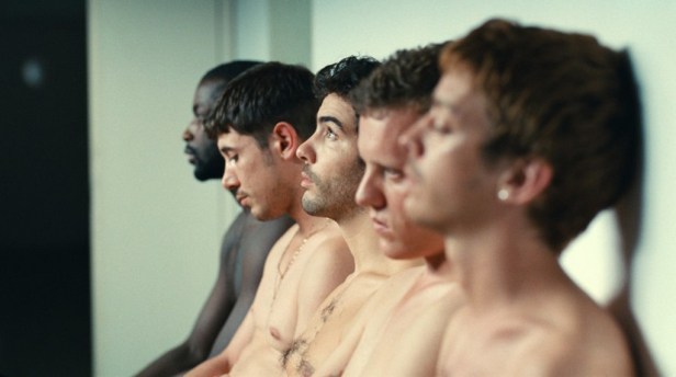 An emphasis on bodies – the young men during the recruitment process for new workers in the plant. Gary (Tahar Rahim) is in the centre of the group.