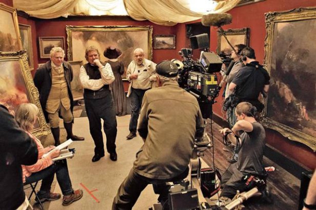 Dick Pope with Leigh and his actors on location for a shoot depicting Turner's 'shop gallery' organised by his father (Paul Jesson, on the extreme left). Image from www.codexdigital.com