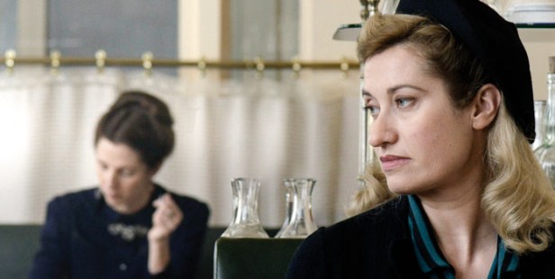 Violette (Emmanuelle Devos) in the foreground with Simone de Beauvoir (Sandrine Kilberlain) in the background.