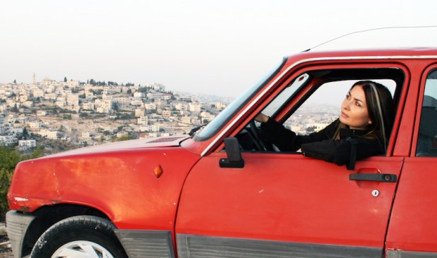 Writer-director Leila Sansour in her battered car.
