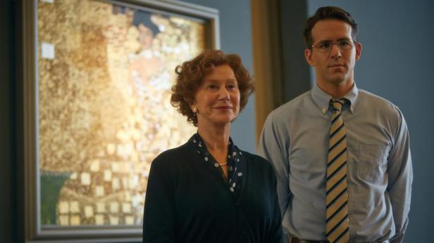 Helen Mirren and Ryan Reynolds pose before a reproduction of the painting.