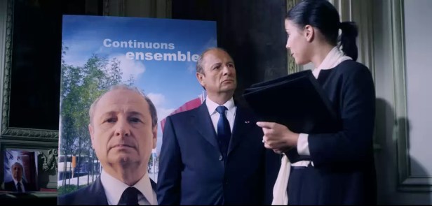 The President with his campaign poster 'Carrying on together'