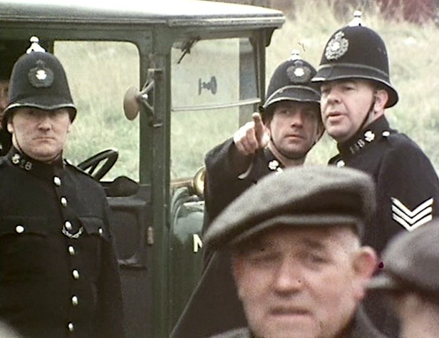 The police arrive in a Durham pit village to arbitrarily arrest striking miners under Emergency Powers legislation in 1921. A shot from DAYS of HOPE Part 2.