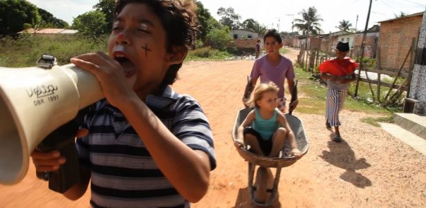 Jonas drumming up an audience for his backyard circus.