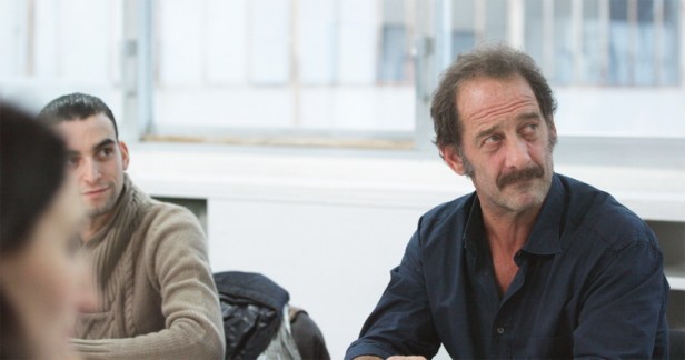 Vincent Lindon as Thierry. In this scene we see him listening to feedback on his performance in a role-play.