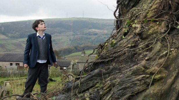 Conor and the yew tree with the South Pennine moors in the background