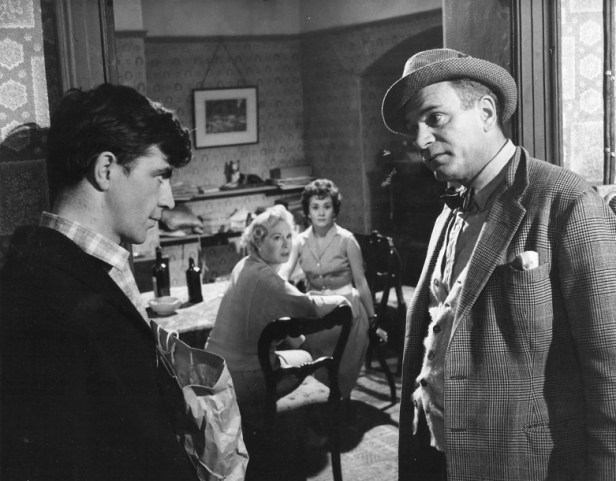 An in-depth composition (looking very much like a stage play) with Frank (Alan Bates) and Archie (Laurence Olivier) in the and (Phoebe) Brenda de Banzie and Jean (Joan Plowright) in the background.