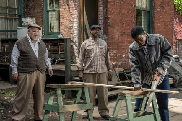 Creating a metaphor in FENCES. From the left, Stephen Henderson as Jim Bono, Denzel Washington as Troy Maxson and Joyvan Adepo as Cory